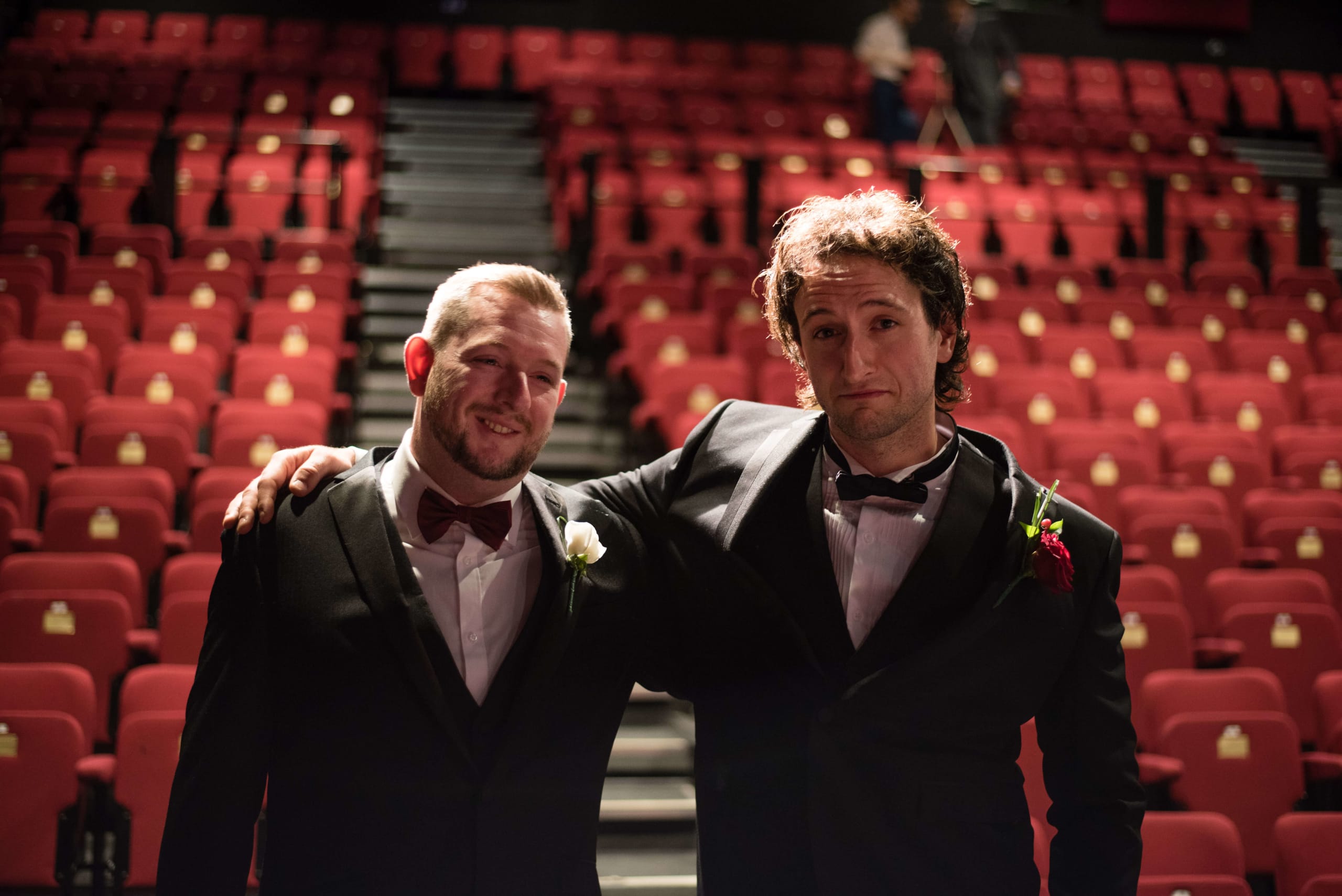 Bridebook.co.uk Groom and best man empty theatre