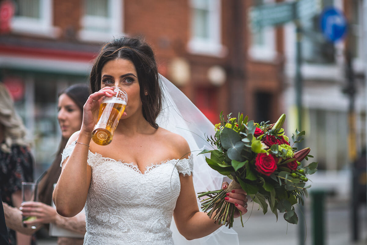 bride drinking a pint