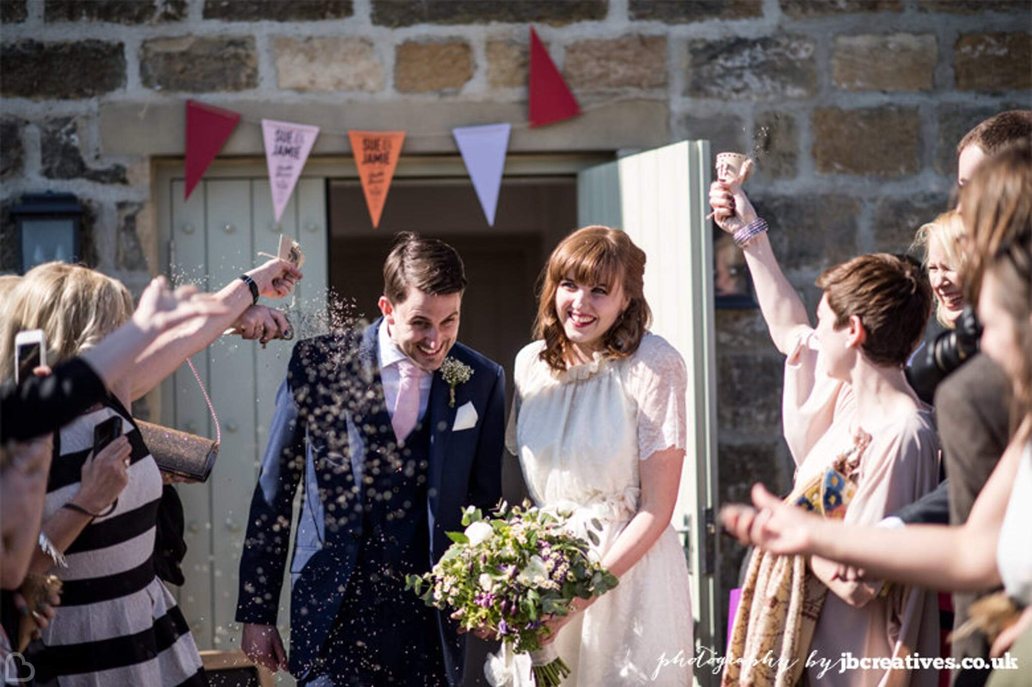 couple confetti shot outside of the Chilli Barn, a wedding venue in yorkshire