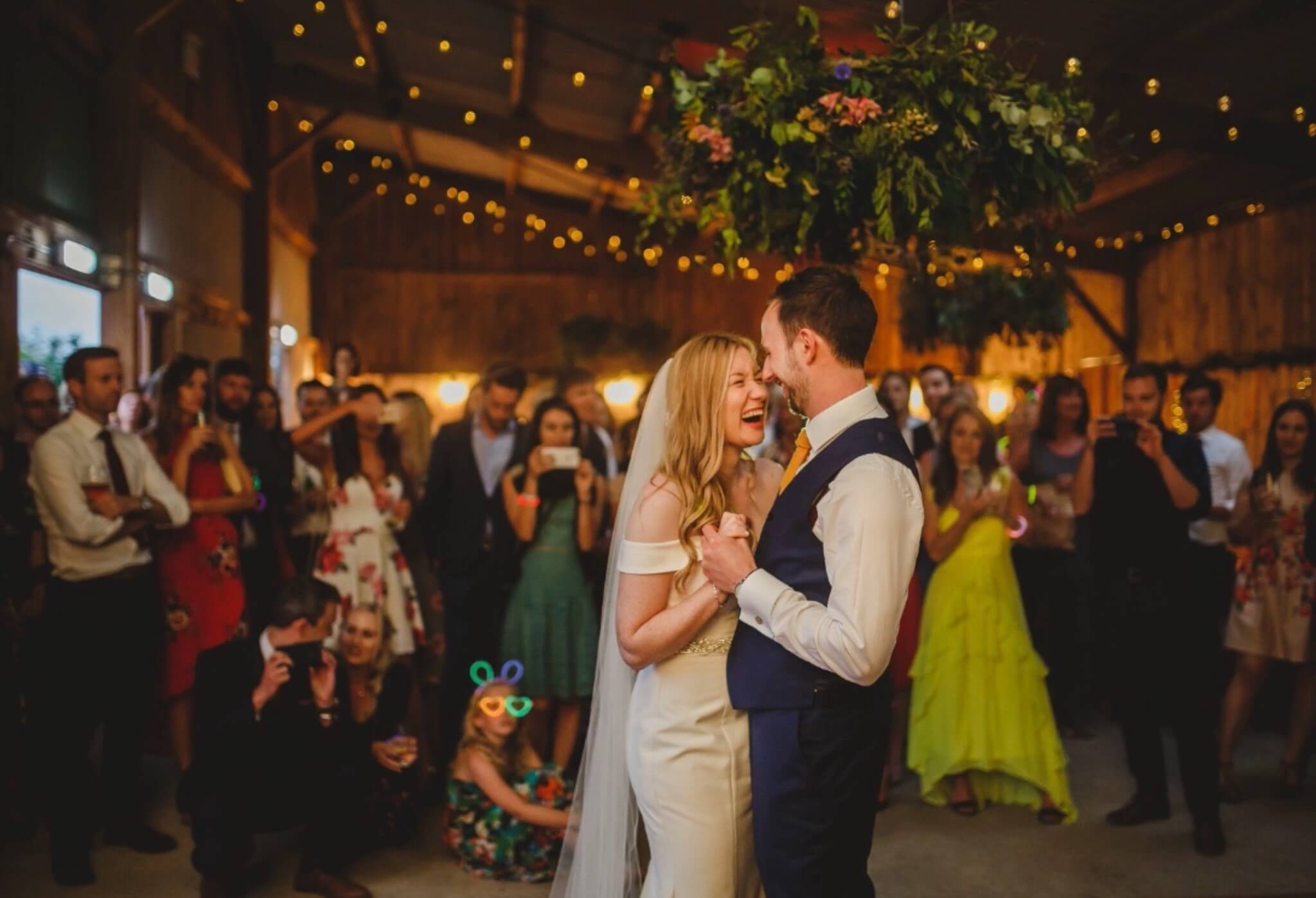 couple laughs as they dance at the barns in east yorkshire