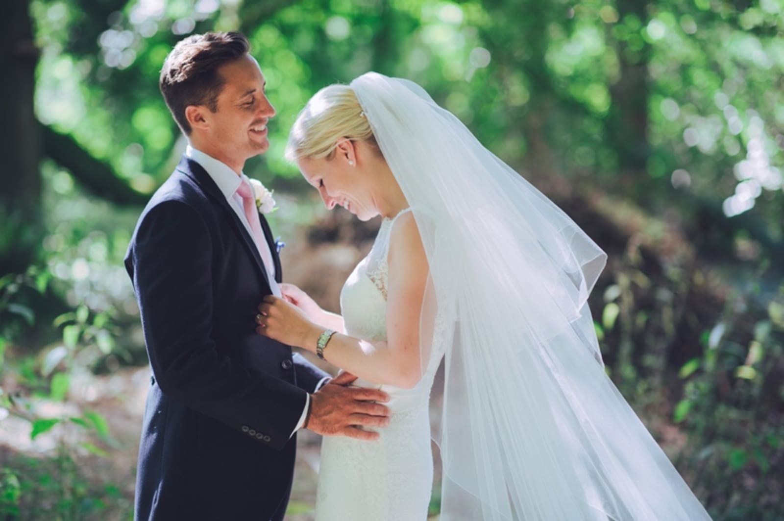 Bridebook.co.uk- bride and groom hug and smile