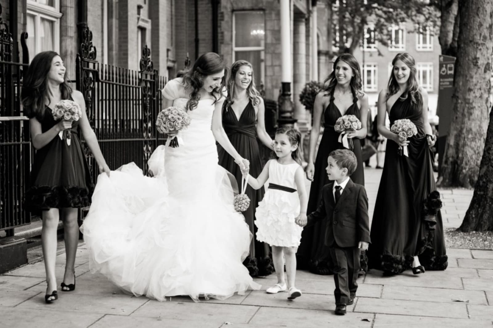 Bridebook.co.uk- bride and bridal party walking to ceremony