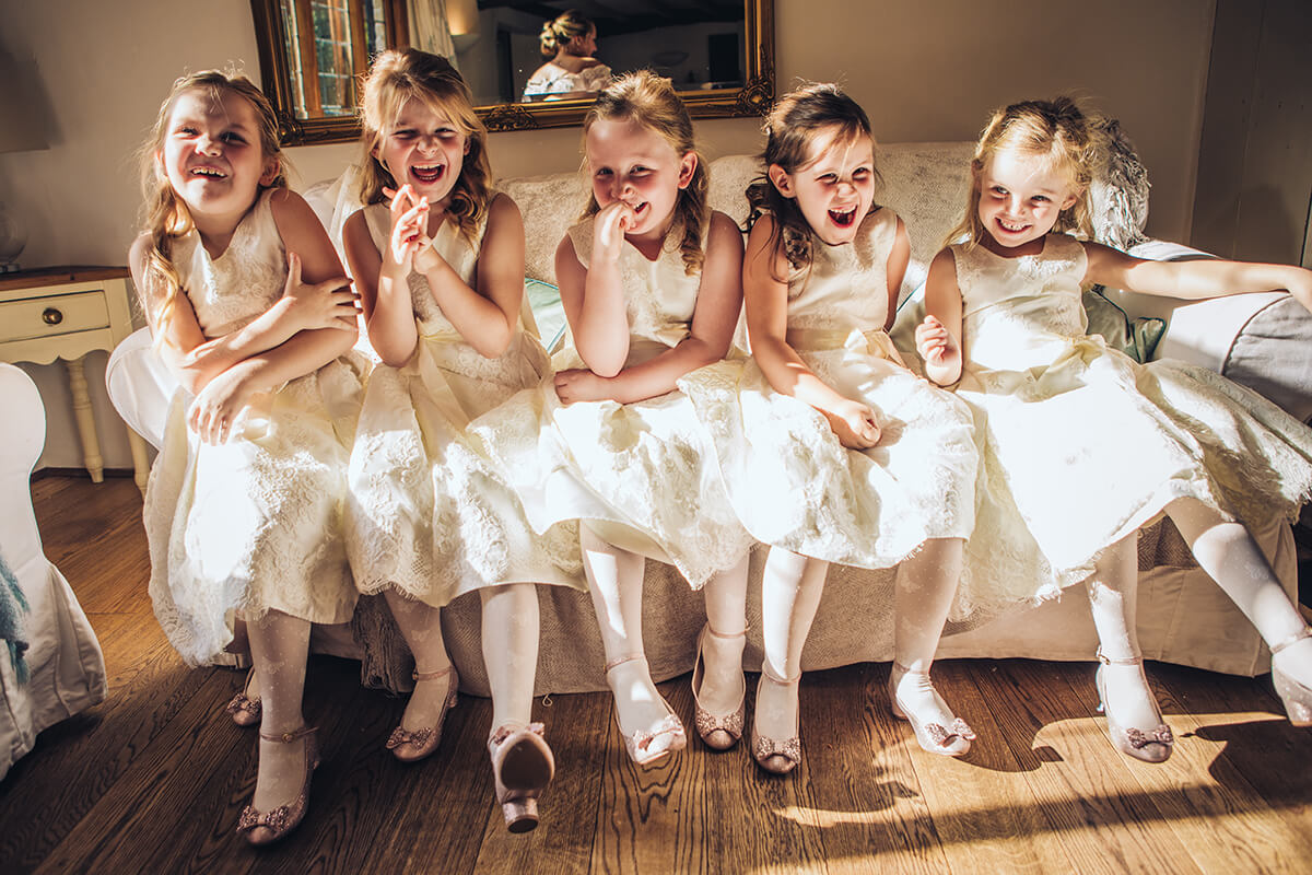 flower girls laughing at wedding