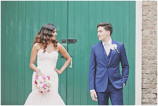 Bridebook.co.uk bride and groom in front of door