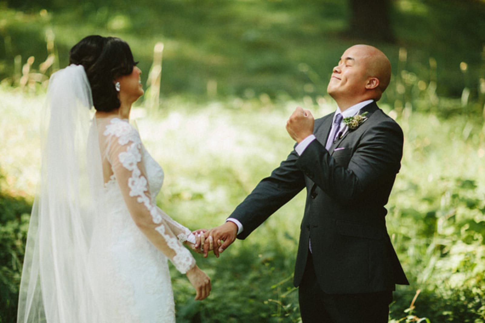 Bridebook.co.uk- groom seeing bride for the first time being very happy