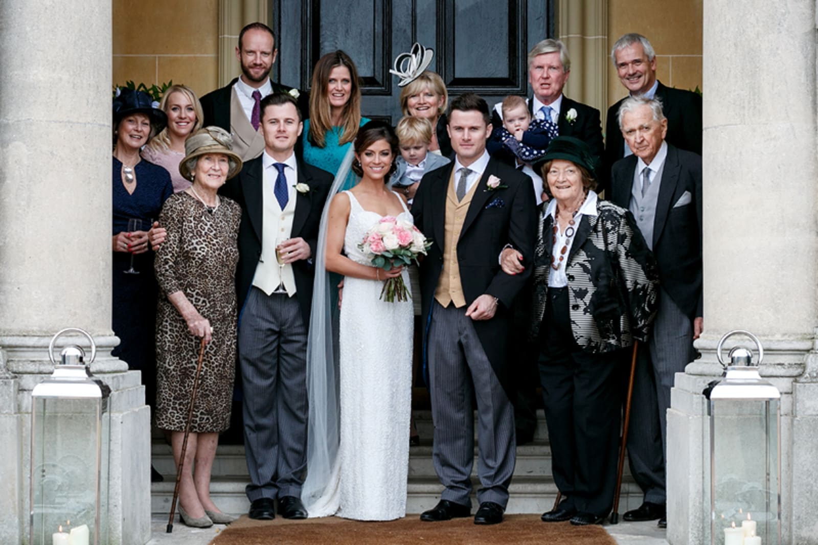 Bridebook.co.uk- bride groom and families outside venue