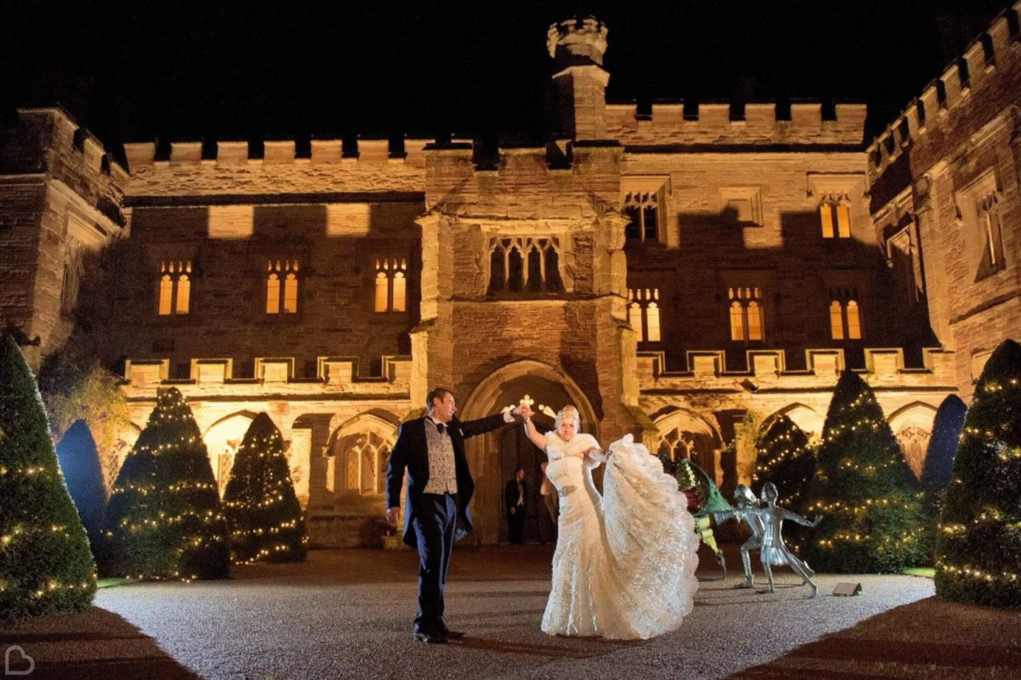  a couple dances outside of hampton court castle