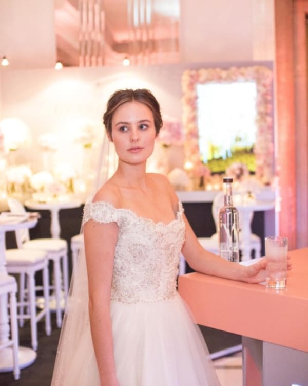 bridebook.co.uk bride holding a glass of water