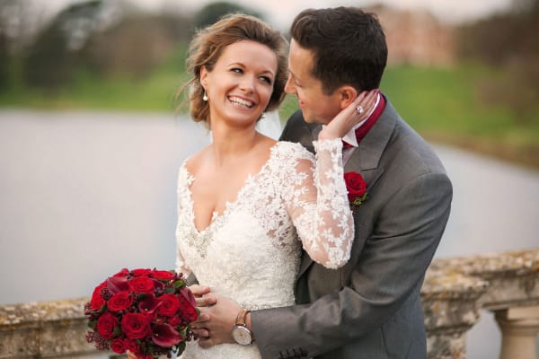 bridebook.co.uk smiling couple on a bridge