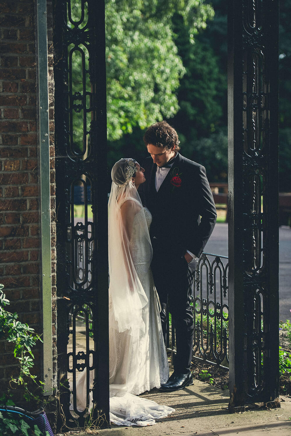 Bridebook.co.uk bride and groom outside on porch