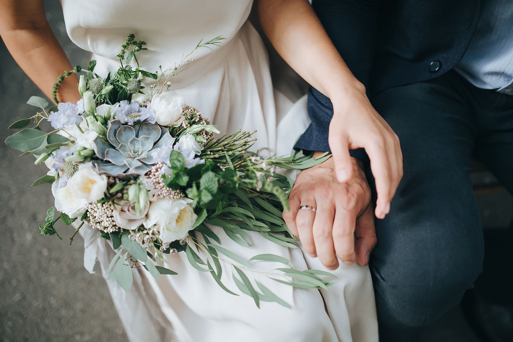 bridebook.co.uk bride and groom holding hands