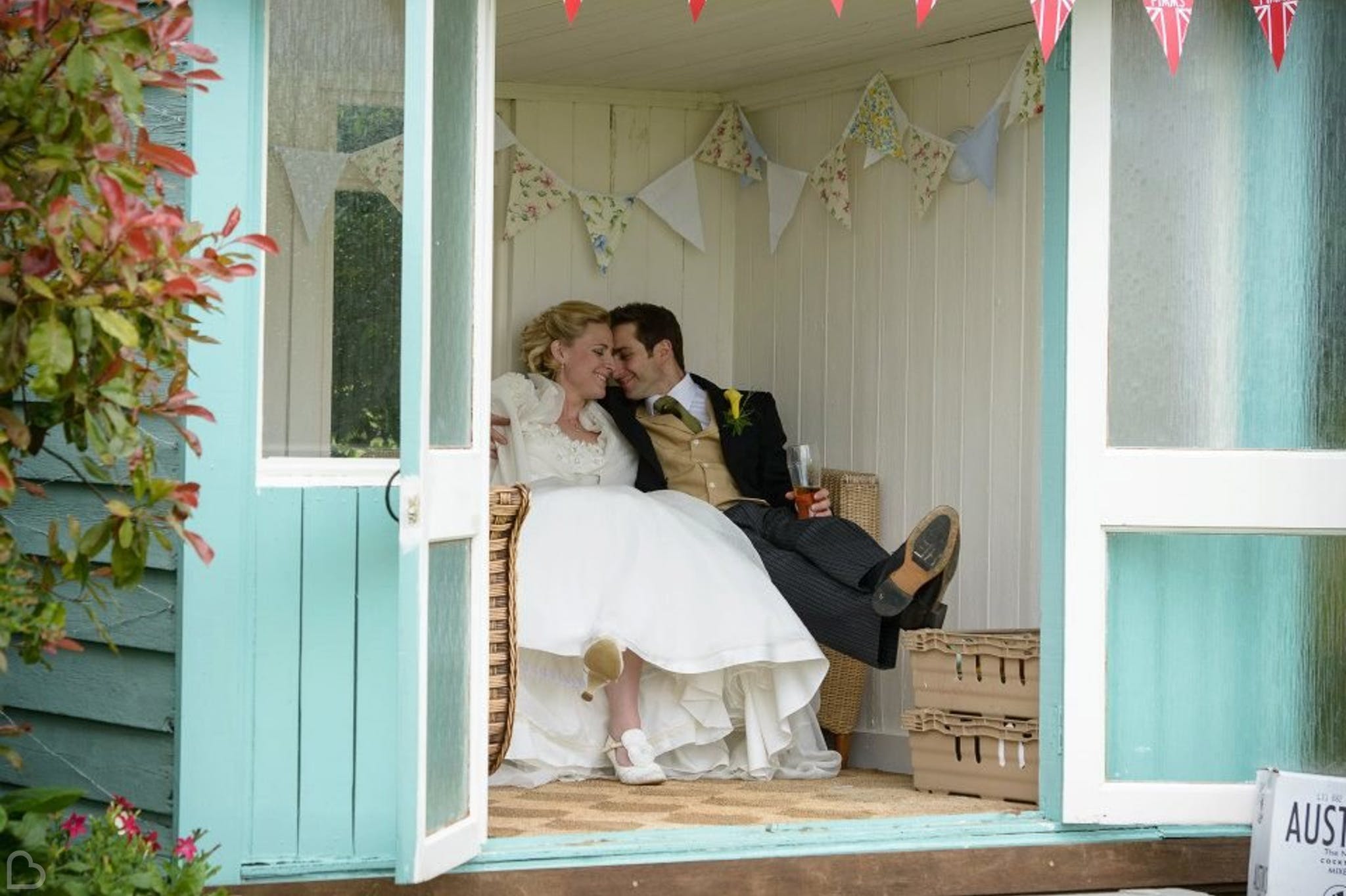 happy newlyweds sitting and drinking champagne at sissons farm 