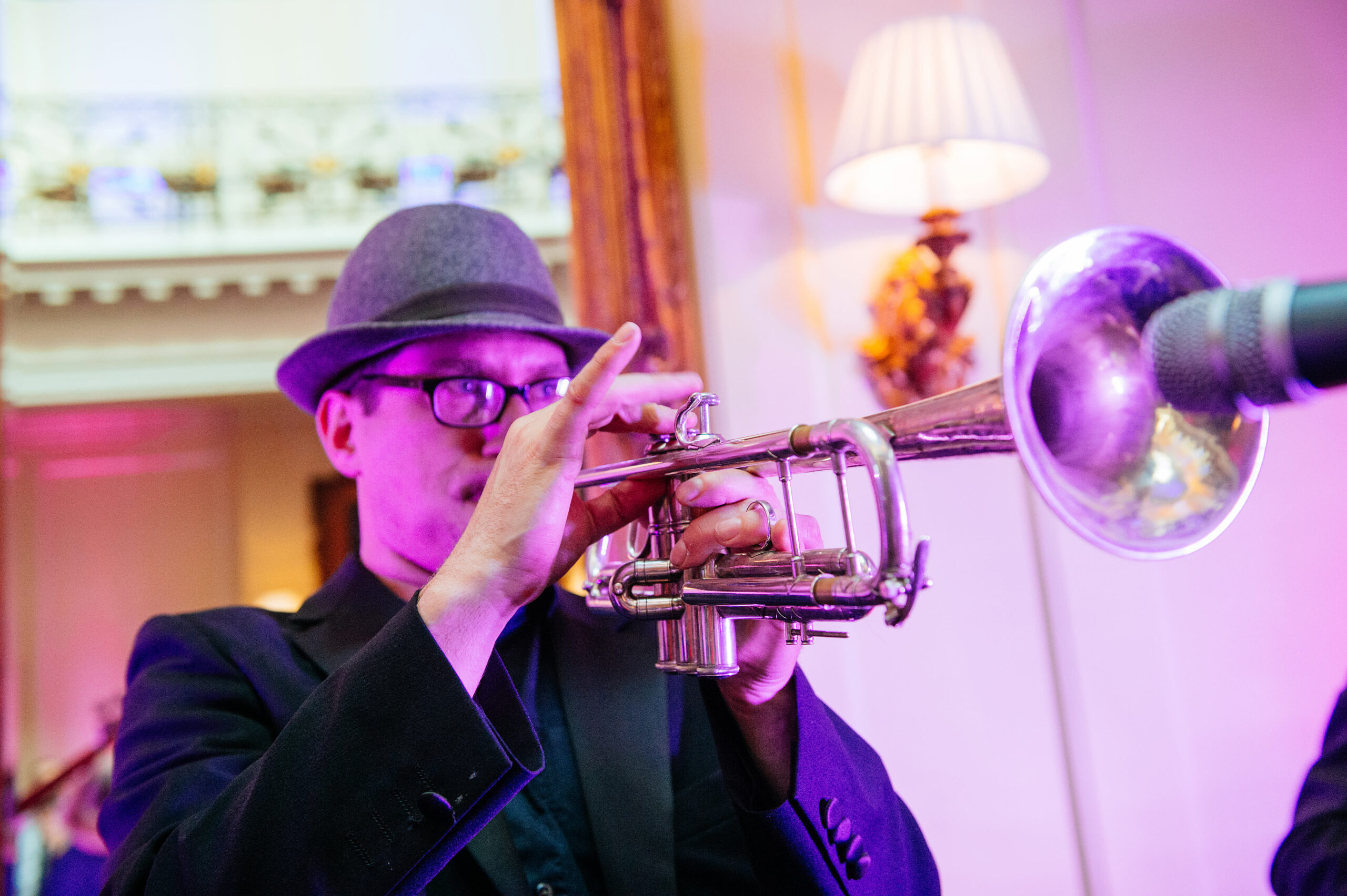 bridebook.co.uk  trumpeter playing at a wedding